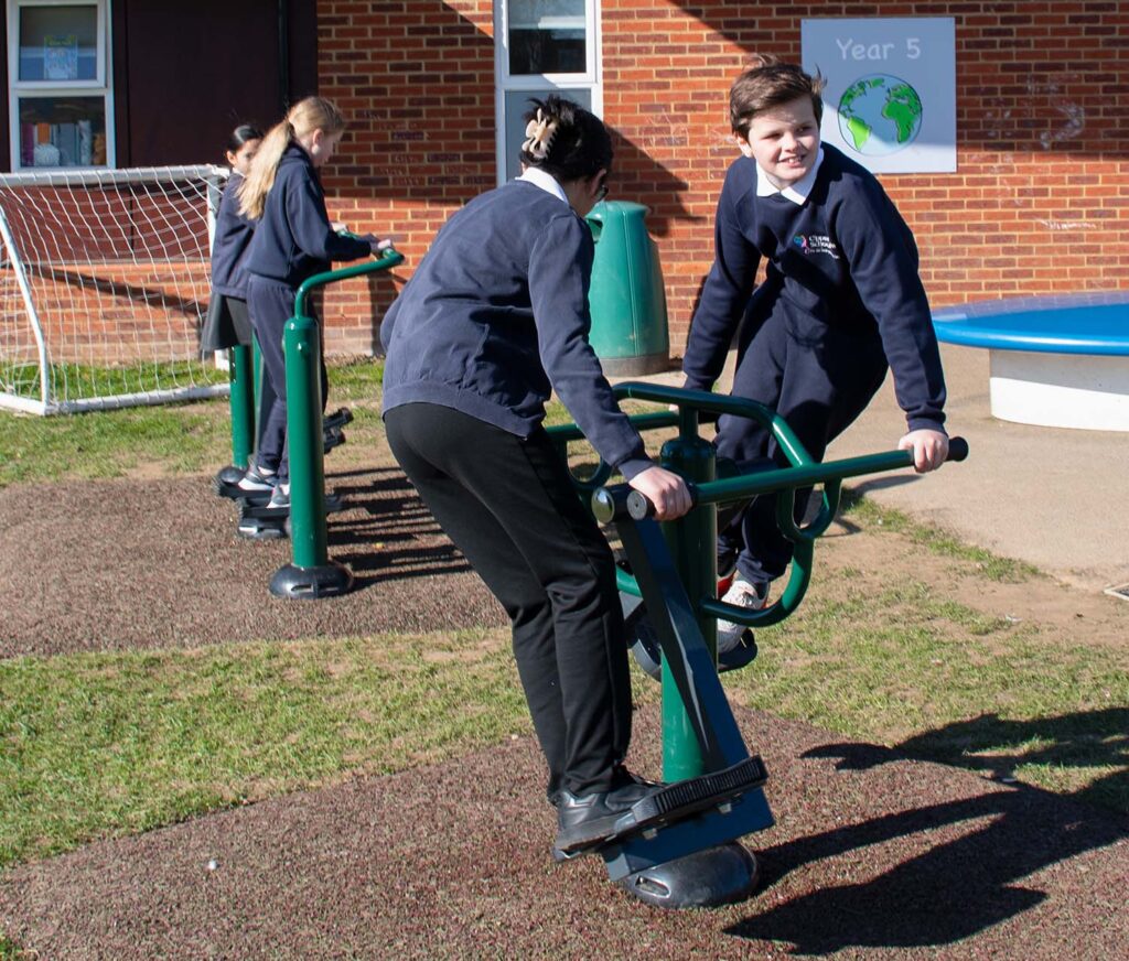 Children Exercising on Outdoor Gym Equipment