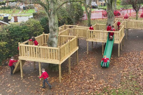 Children playing on tower and slide