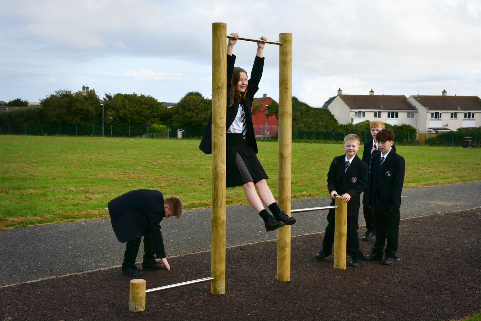 School pupils using pull up bars