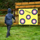 Child Throwing Ball at Throw Wall Target